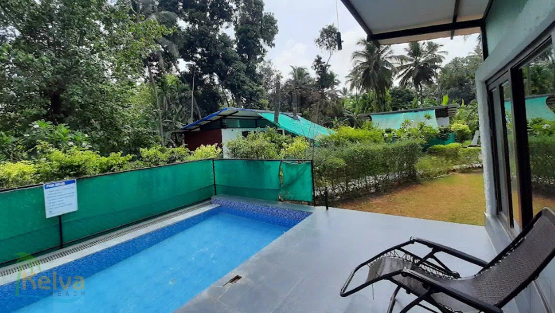 The Palm Orchard Agro Resort room with swmimming pool